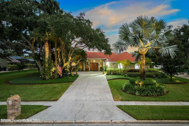 view of front of home with a lawn