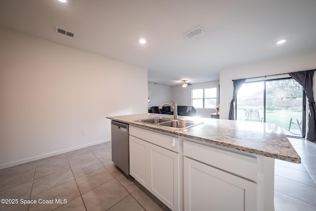 kitchen with sink, a kitchen island with sink, light stone counters, white cabinets, and stainless steel dishwasher