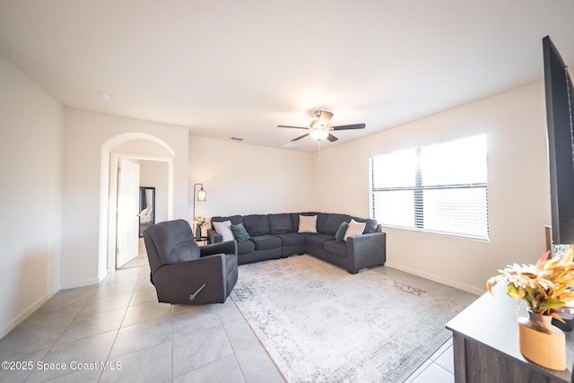 living room with light tile patterned floors and ceiling fan