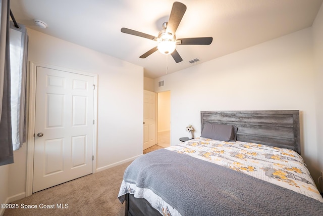 carpeted bedroom with ceiling fan