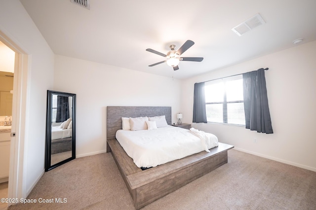 bedroom featuring light colored carpet and ceiling fan