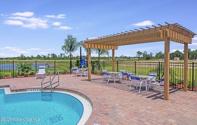 view of swimming pool with a water view, a pergola, and a patio area