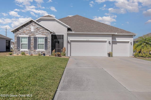 view of front of property with a garage and a front yard