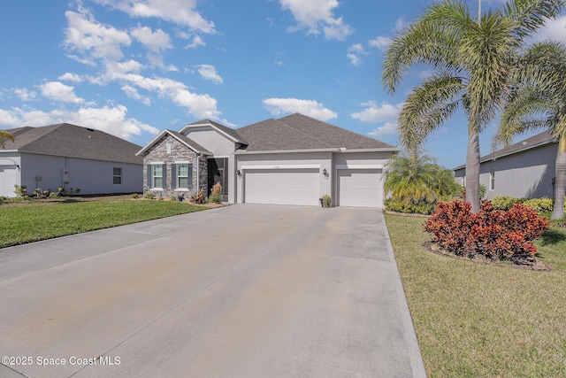 view of front of property featuring a garage and a front lawn