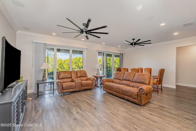 living room featuring crown molding, ceiling fan, and light hardwood / wood-style flooring