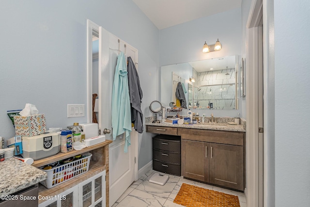 bathroom with vanity and a shower with shower door