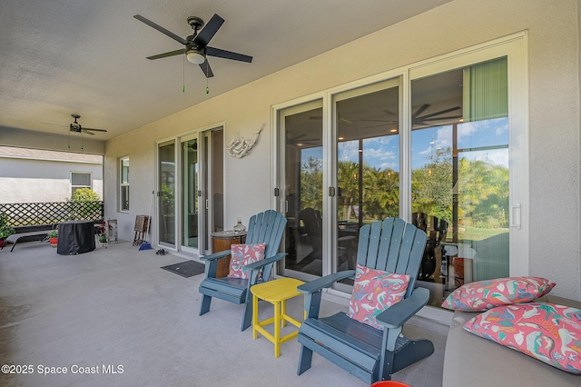 view of patio featuring ceiling fan