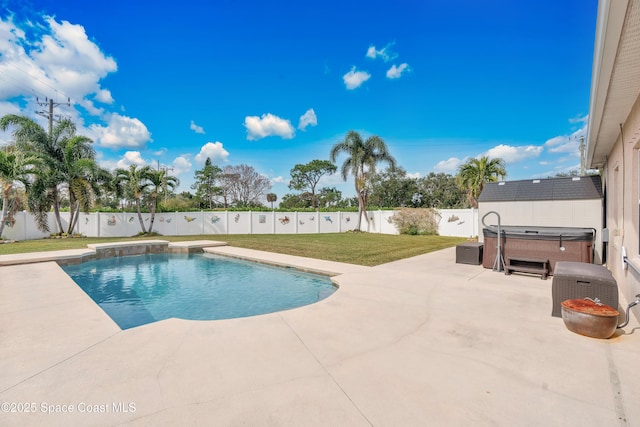 view of pool featuring a lawn, a hot tub, and a patio