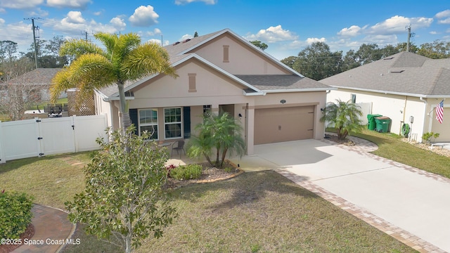 view of front facade with a garage, a front yard, and covered porch