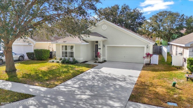 view of front of home with a garage and a front lawn