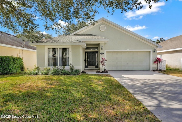 view of front of property with a garage and a front lawn