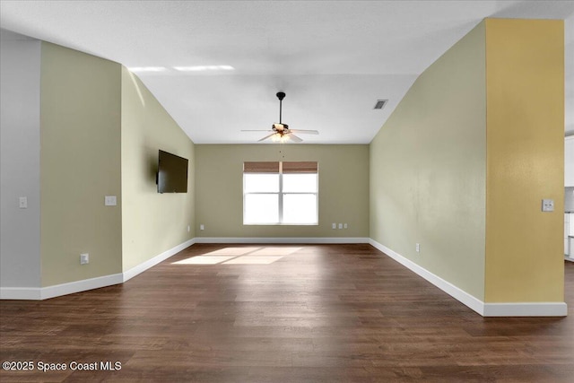 spare room featuring ceiling fan, lofted ceiling, and hardwood / wood-style floors