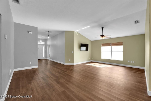 unfurnished living room featuring lofted ceiling, hardwood / wood-style flooring, and ceiling fan