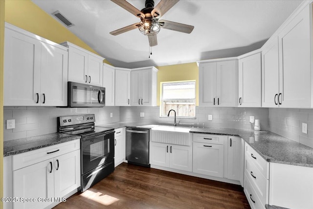 kitchen with white cabinetry, black electric range oven, stainless steel dishwasher, and dark wood-type flooring