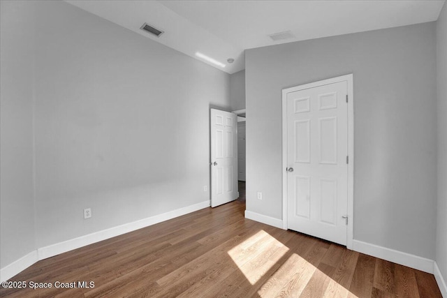 unfurnished bedroom featuring wood-type flooring