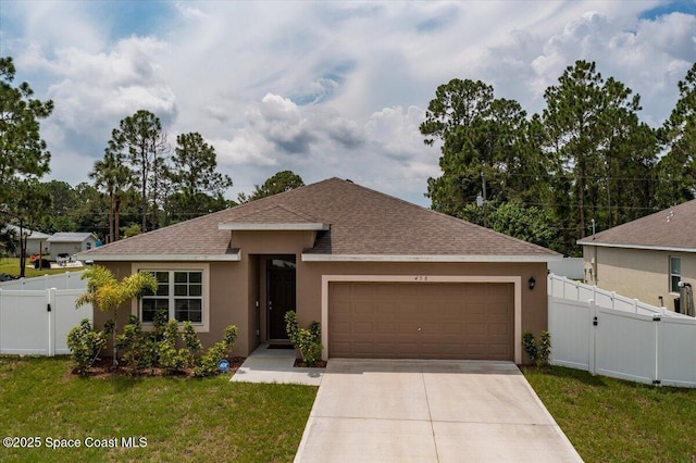 view of front of property with a garage and a front lawn