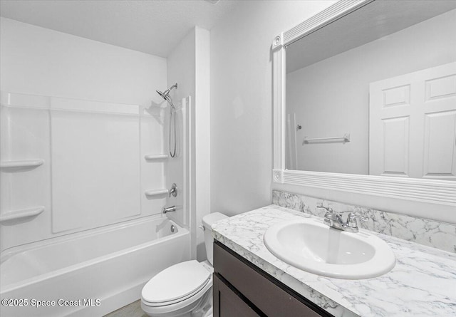 bathroom with vanity, toilet, and washtub / shower combination