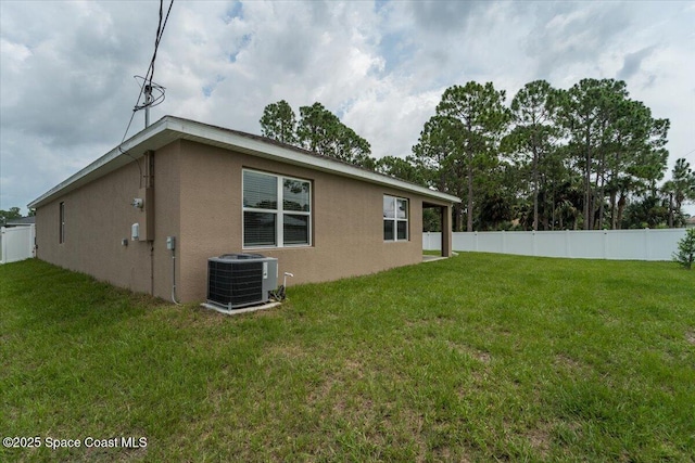 view of property exterior featuring fence, central AC, and stucco siding