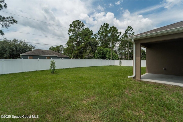 view of yard featuring a patio area and a fenced backyard