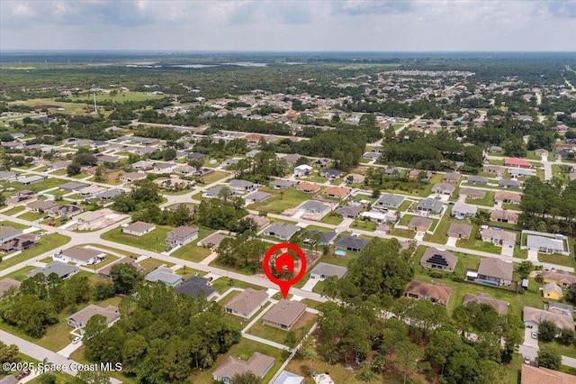 birds eye view of property with a residential view