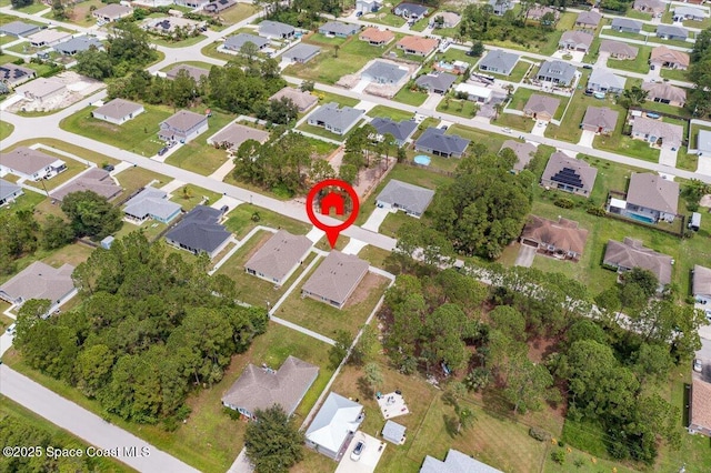 birds eye view of property with a residential view