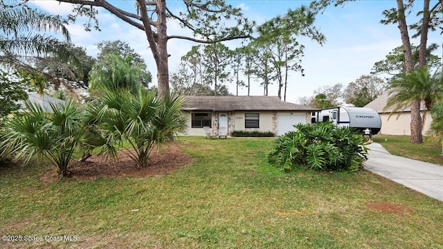 view of front of home featuring a garage and a front yard