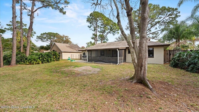 view of yard with a sunroom