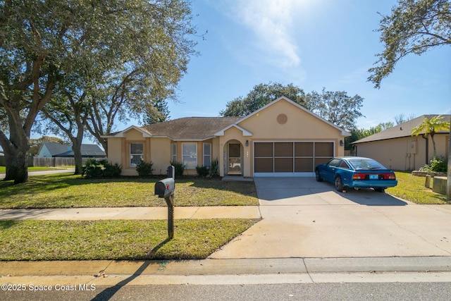 ranch-style house featuring a garage and a front yard