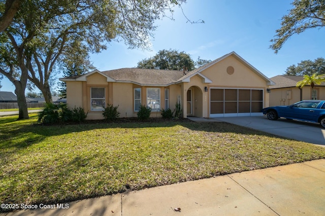 ranch-style house featuring a garage and a front yard