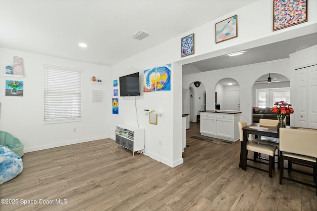 interior space with ceiling fan and light hardwood / wood-style floors