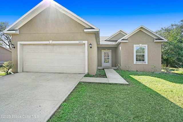 view of front of house featuring a garage and a front lawn