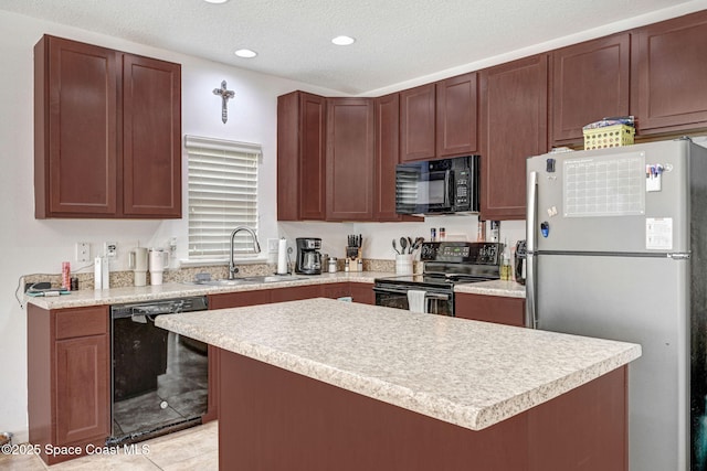 kitchen featuring sink, a textured ceiling, light tile patterned floors, a kitchen island, and black appliances