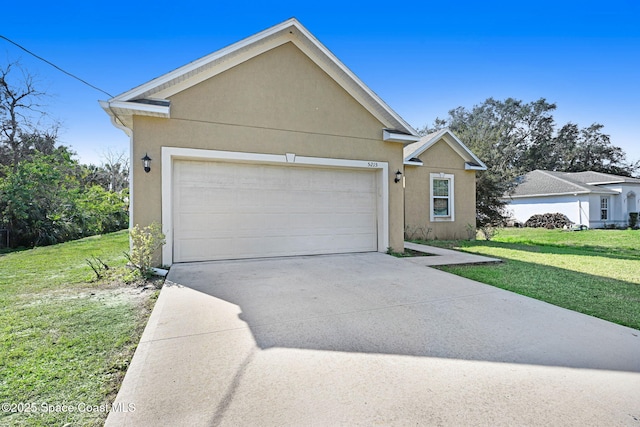 view of front of house with a garage and a front lawn