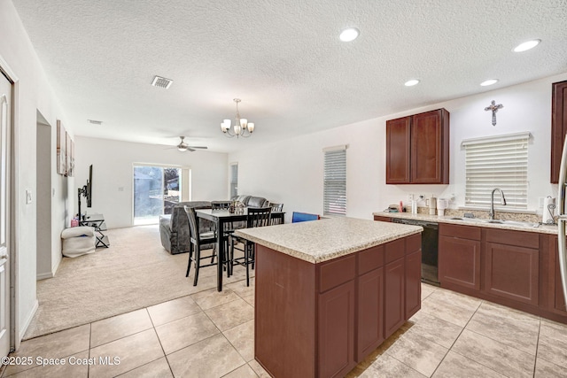 kitchen with a kitchen island, pendant lighting, sink, black dishwasher, and light carpet