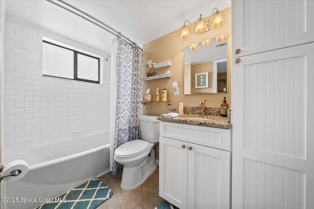 full bathroom featuring tile patterned flooring, vanity, toilet, and shower / bath combo with shower curtain