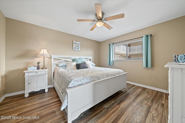 bedroom with dark hardwood / wood-style floors and ceiling fan