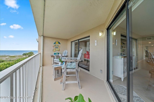 balcony featuring a water view