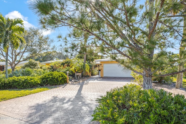 obstructed view of property featuring a garage