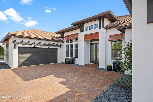 view of front of house featuring french doors and a garage