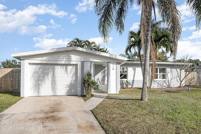 single story home with a garage and a front yard