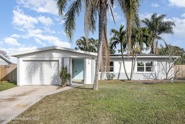 view of front of house featuring a garage and a front yard