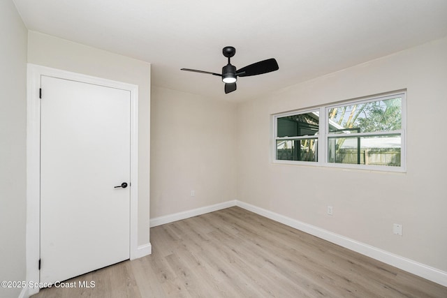 unfurnished room featuring ceiling fan and light wood-type flooring