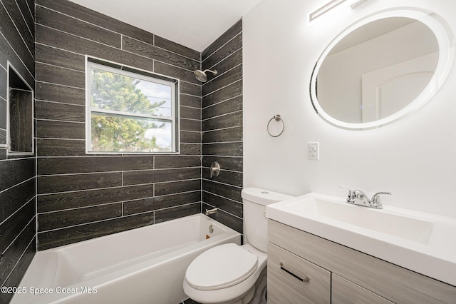 full bathroom with tiled shower / bath combo, vanity, and toilet