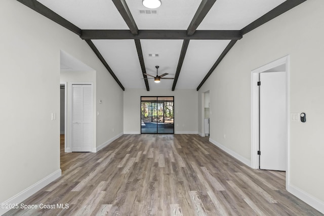 unfurnished living room featuring ceiling fan, light hardwood / wood-style floors, and lofted ceiling with beams