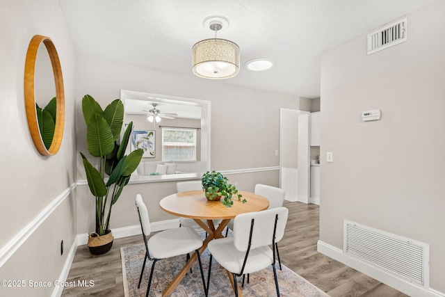 dining room with hardwood / wood-style floors