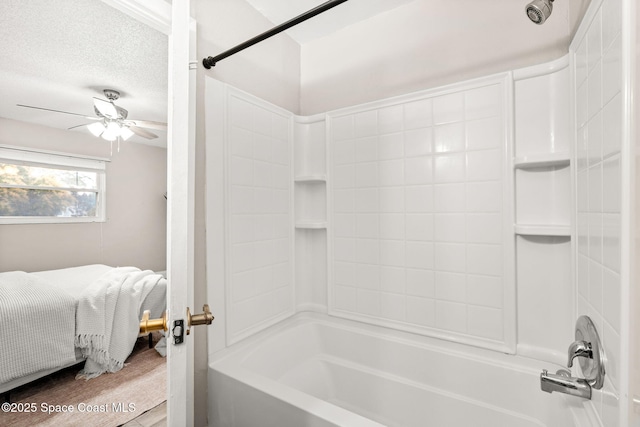 bathroom with ceiling fan, hardwood / wood-style flooring, bathtub / shower combination, and a textured ceiling