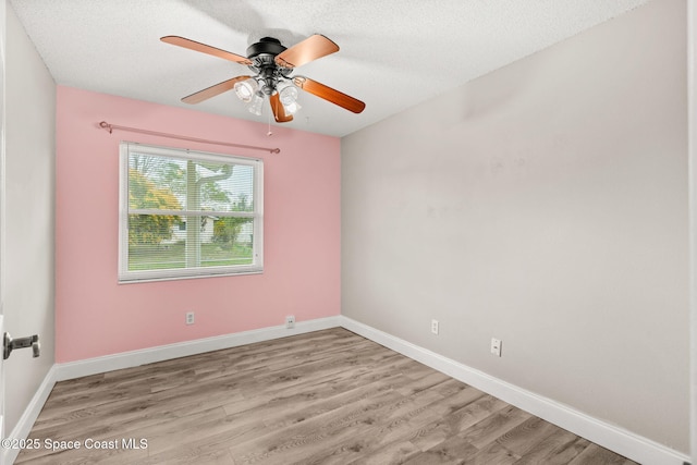 unfurnished room featuring ceiling fan, a textured ceiling, and light hardwood / wood-style flooring