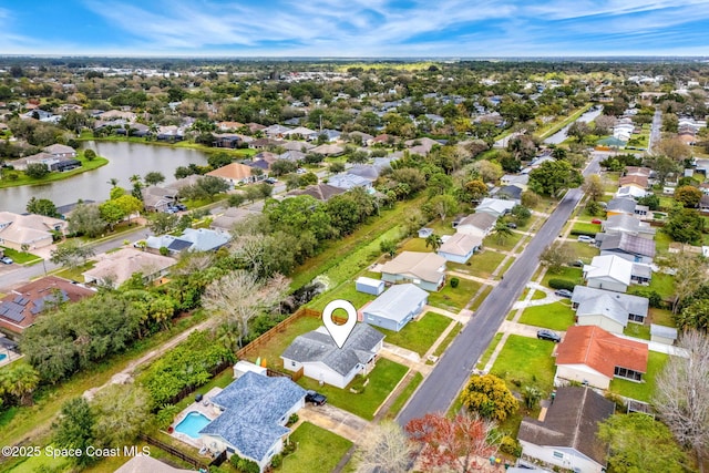 birds eye view of property featuring a water view