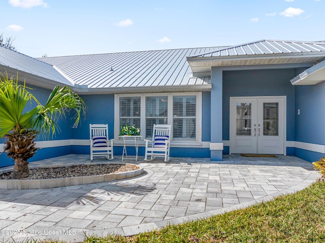 entrance to property with french doors and a patio