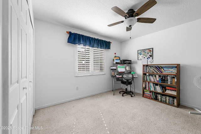 office space with ceiling fan and a textured ceiling